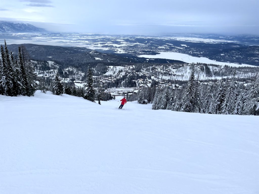 View of the town of Whitefish and Whitefish lake from the south side of Big Mountain, January 2022